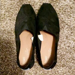 Black toms slip on